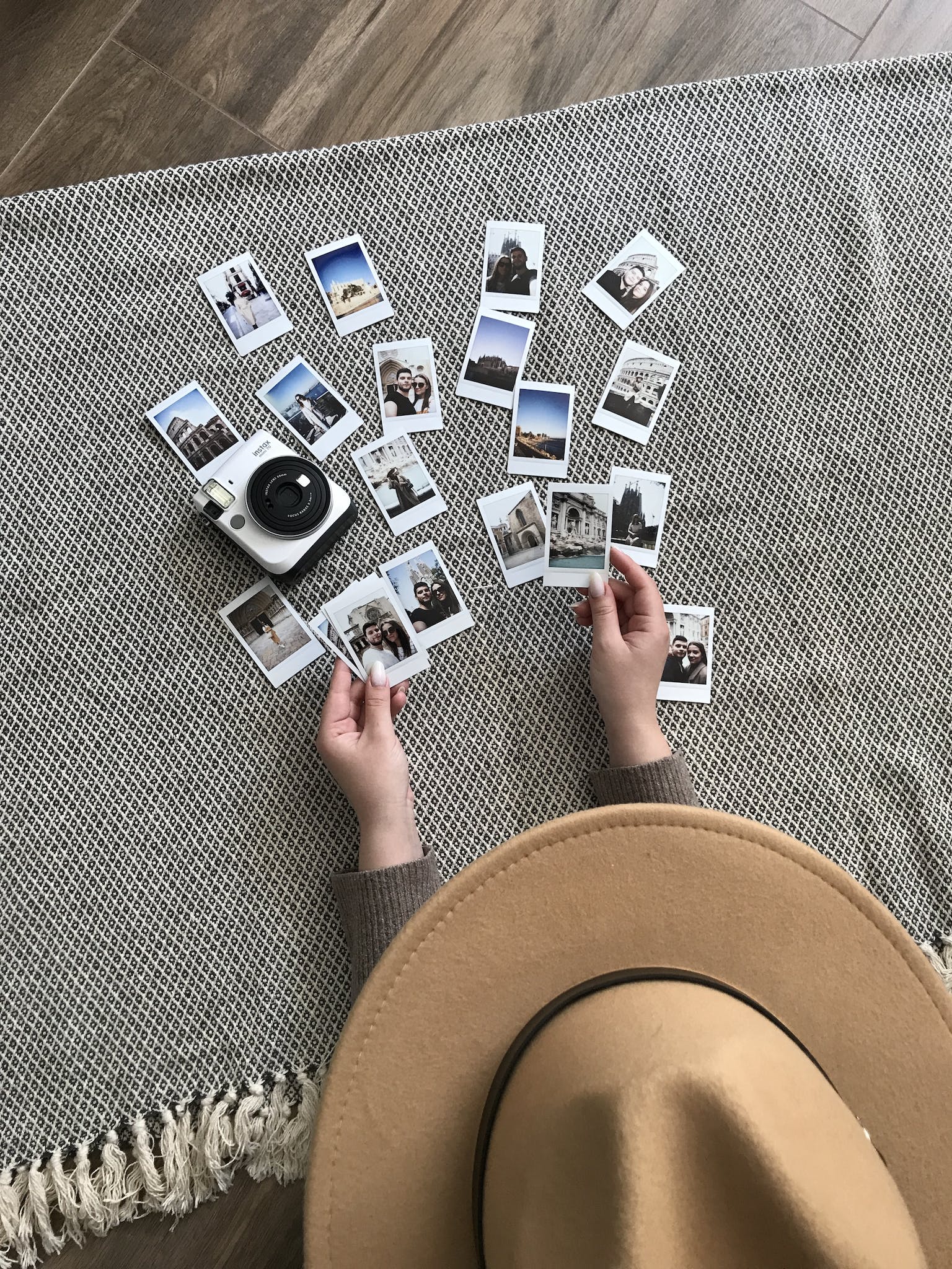 Person Holding Instant Pictures